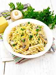 Image showing Fusilli with mushrooms and cream on board