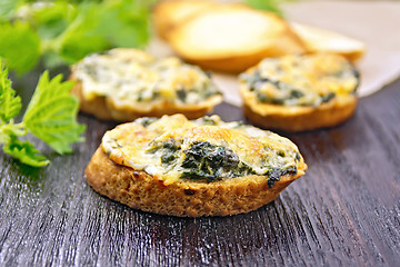 Image showing Sandwich of nettle and cheese on dark board