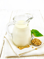 Image showing Milk soy in jug with leaf on board