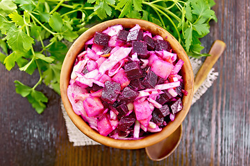 Image showing Vinaigrette in bowl on dark board top