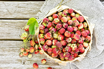 Image showing Strawberries in box on old board top