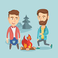 Image showing Two friends sitting around bonfire in camping.