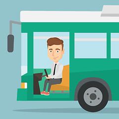 Image showing Caucasian bus driver sitting at steering wheel.