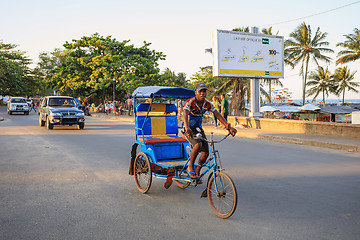 Image showing Traditional rickshaw bicycle with malagasy peoples in Toamasina,