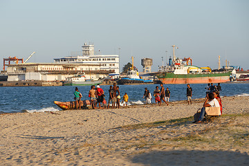 Image showing Malagasy peoples resting on the beach in harbor