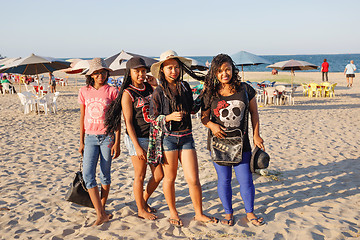 Image showing Malagasy beauties, teenager  girls resting on the beach