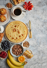 Image showing Various breakfast ingredients placed on stone table