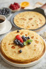 Image showing Various breakfast ingredients placed on stone table