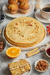 Image showing Various breakfast ingredients placed on stone table