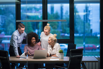 Image showing Multiethnic startup business team in night office