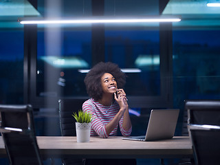 Image showing black businesswoman using a laptop in startup office