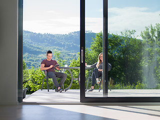 Image showing couple enjoying morning coffee and breakfast