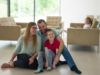 Image showing family with little boy enjoys in the modern living room