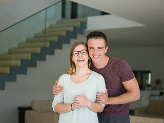 Image showing couple hugging in their new home