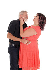 Image showing Kissing middle age couple