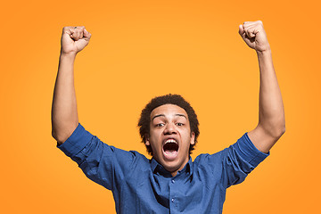 Image showing Winning success man happy ecstatic celebrating being a winner. Dynamic energetic image of male model