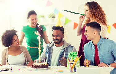 Image showing team greeting colleague at office birthday party