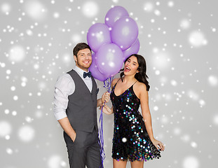 Image showing happy couple with ultra violet balloons at party