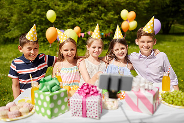 Image showing happy kids taking selfie on birthday party