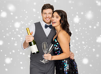 Image showing happy couple with champagne celebrating christmas