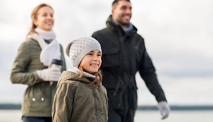 Image showing happy girl with family at autumn beach