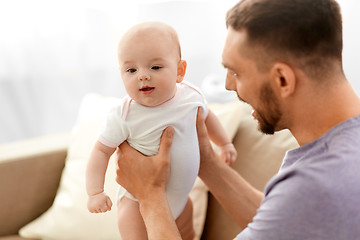 Image showing father with little baby girl at home