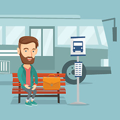 Image showing Businessman waiting for bus at the bus stop.