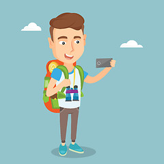 Image showing Man with backpack making selfie.