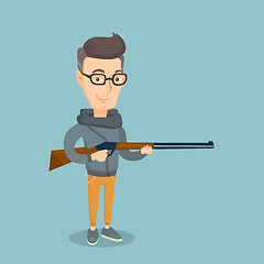 Image showing Adult hunter holding a hunting rifle.