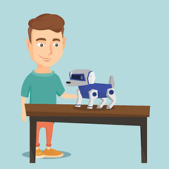 Image showing Happy young man playing with robotic dog.