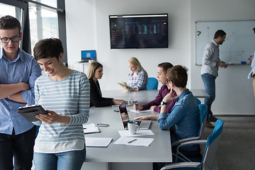 Image showing Two Business People Working With Tablet in office