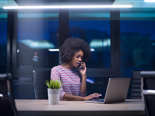 Image showing black businesswoman using a laptop in startup office