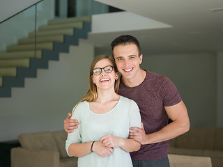 Image showing couple hugging in their new home