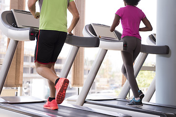 Image showing people exercisinng a cardio on treadmill in gym