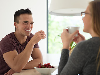 Image showing couple enjoying morning coffee and strawberries