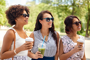 Image showing happy women or friends with drinks at summer park