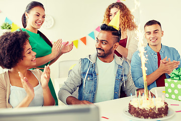 Image showing office team greeting colleague at birthday party