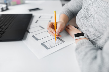 Image showing web designer working on user interface at office