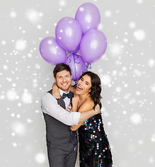 Image showing happy couple with ultra violet balloons at party