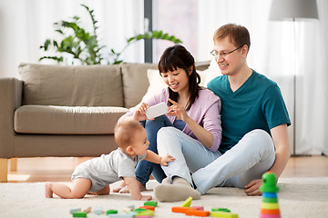 Image showing happy family with baby boy at home