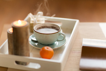 Image showing hot chocolate, christmas gift and candles on table