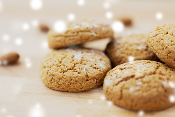 Image showing close up of oatmeal cookies over snow