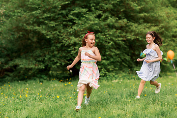 Image showing happy girls playing tag game at birthday party