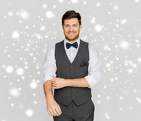 Image showing happy man in festive suit dressing for party