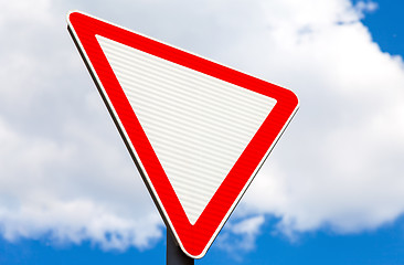 Image showing Give way traffic sign above cloudy sky