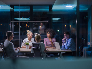 Image showing Multiethnic startup business team in night office