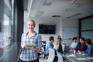 Image showing Pretty Businesswoman Using Tablet In Office Building by window