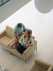 Image showing couple relaxing at  home with tablet computers