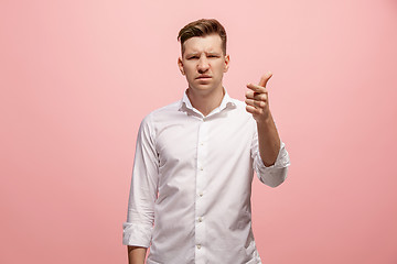 Image showing The overbearing businessman point you and want you, half length closeup portrait on pink background.