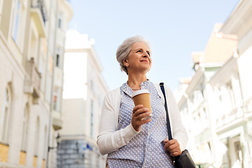 Image showing senior woman drinking coffee at summer city